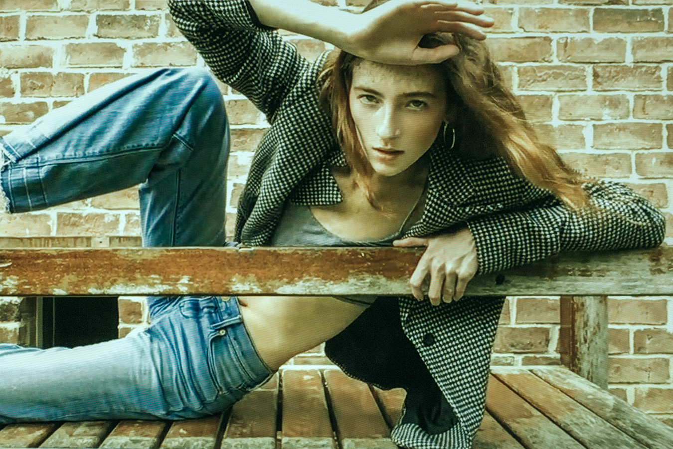 Redheaded model Kate Kremer posing in a suit jacket and jeans in Texas photographed by Joshua Pyles